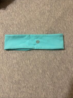 lululemon athletica aqua headband with reflective logo